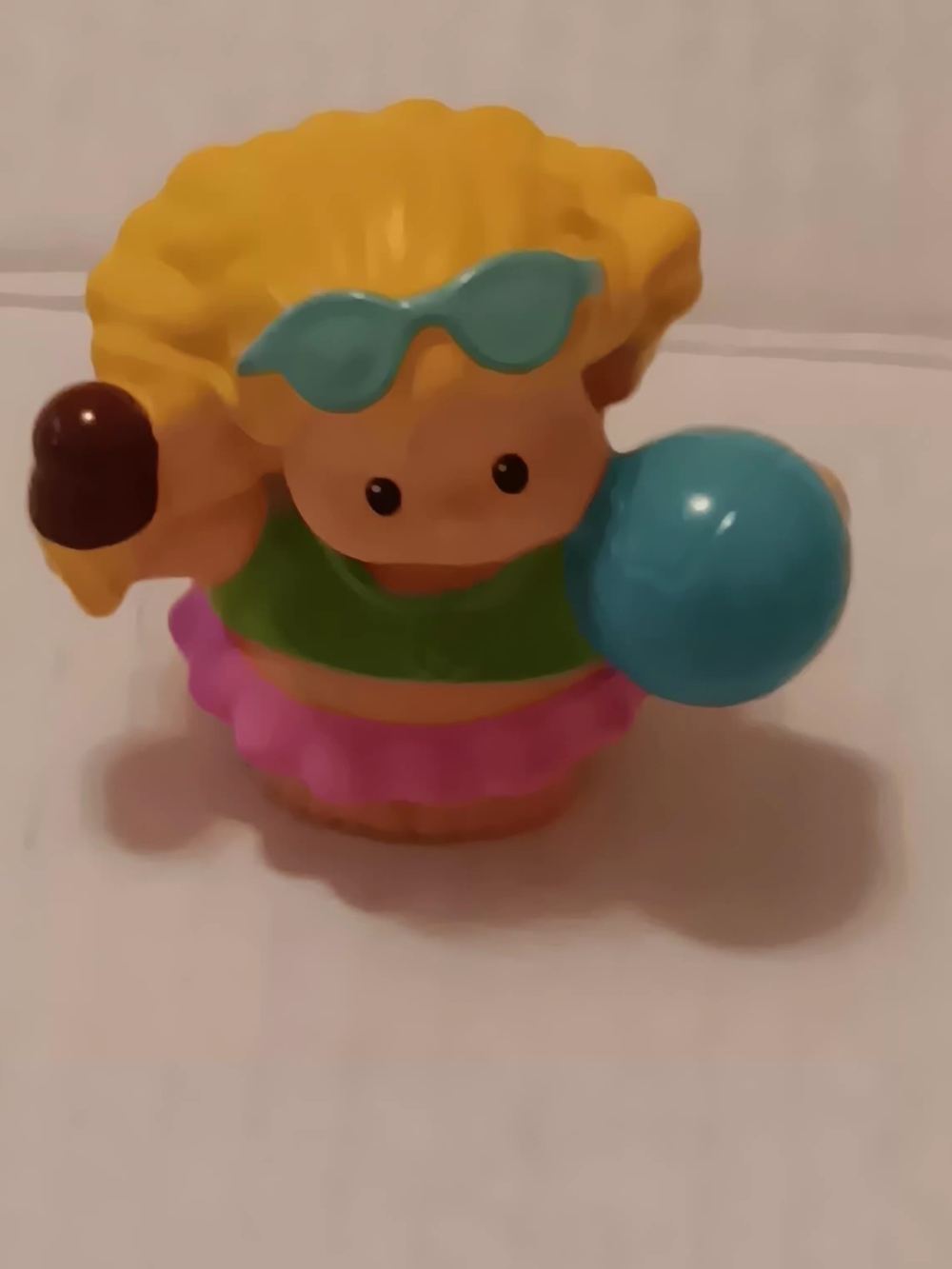 Fisher-Price Little People Sarah Lynn toy holding a beach ball and ice cream